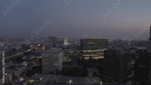 Wallpaper Mural Dramatic aerial shot flying backwards above buildings in downtown Los Angeles, California. Shot during a dark sunset. Torontodigital.ca