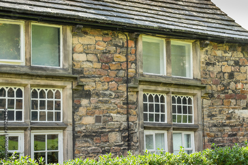 Recently renovated stonework medieval era house showing its gothic style windows and stone built construction. Attracting visits from across the globe.