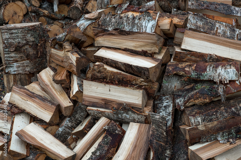 A pile of firewood for the stove, background A pile of firewood for the stove, background