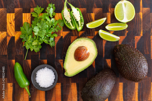 Fresh ingredients avocado, lime, cilantro, chilli with corn chips tortillas