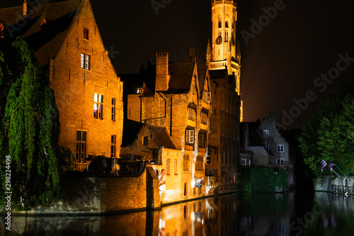 Bruges night street and river tourism photo