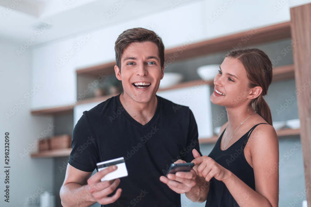 young couple making an order in the online store young couple making an order in the online store