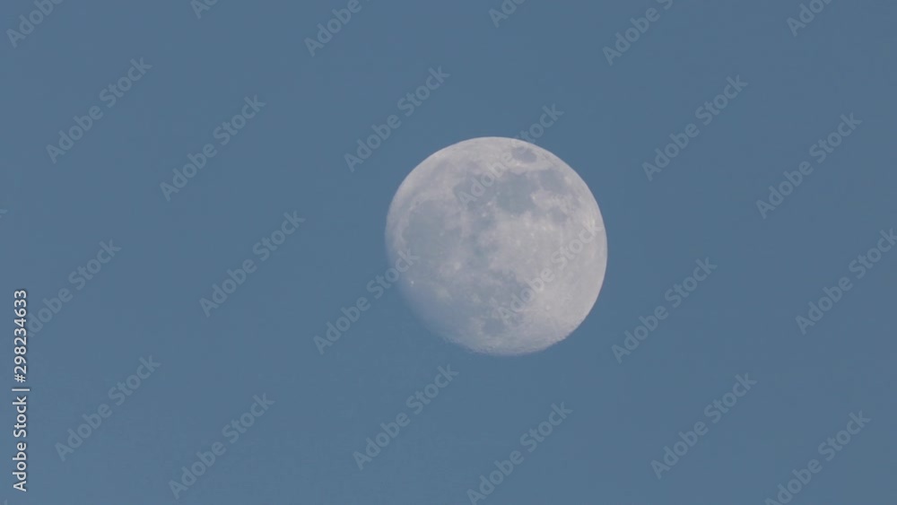 Waning Moon In Blue Sky