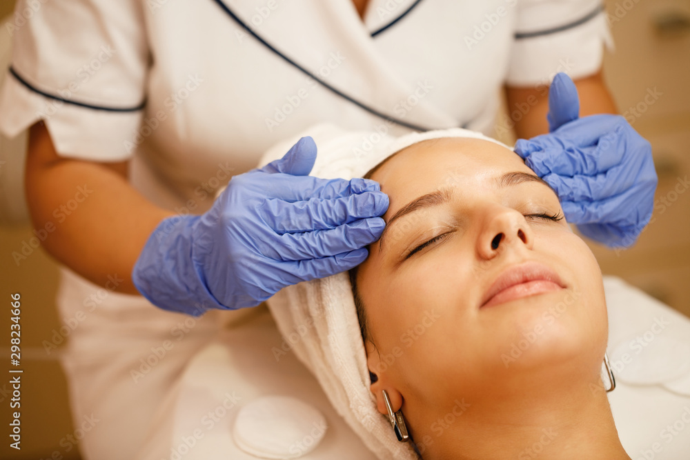Close-up of young woman enjoying in head massage at the spa. Close-up of young woman enjoying in head massage at the spa.