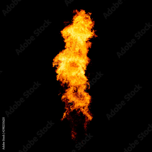 Flame jet goes from gas burner, isolated fire pillar on black.