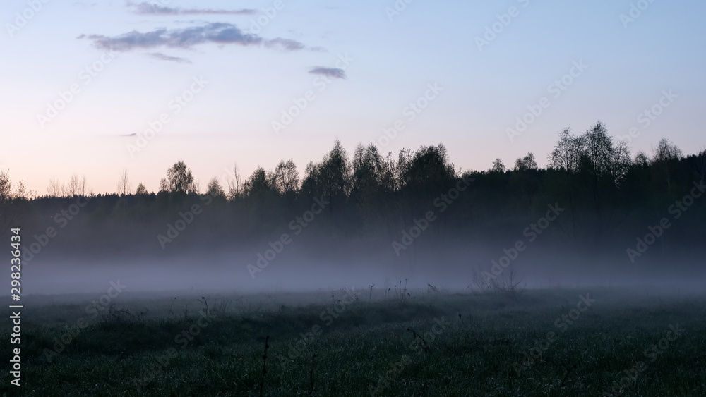 Magnificent heavy morning mist in landscape. Autumn creamy fog in countryside.