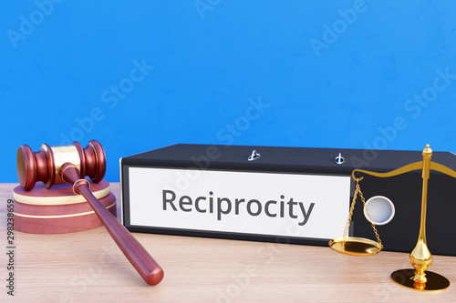 Reciprocity – Folder with labeling, gavel and libra – law, judgement, lawyer photo