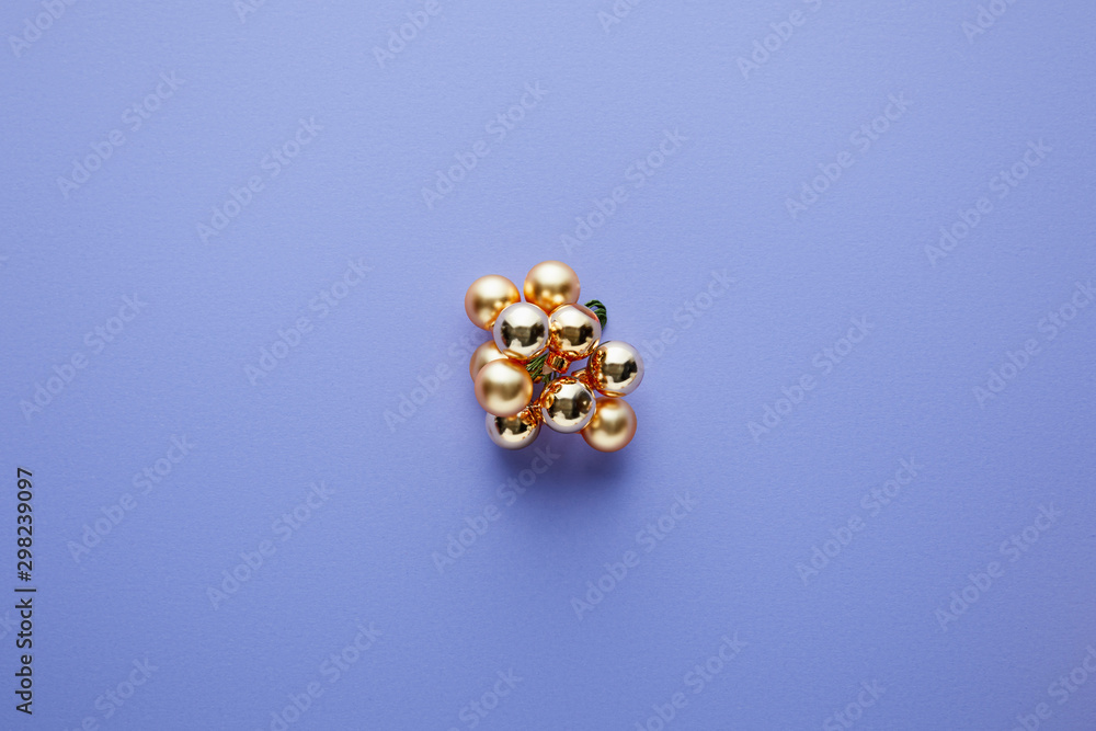 top view of shiny golden Christmas decoration on blue background top view of shiny golden Christmas decoration on blue background