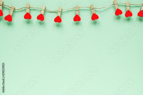 Hearts on pastel mint background. Valentines day concept. Flat lay, top view, copy space. Valentine's Day background.
