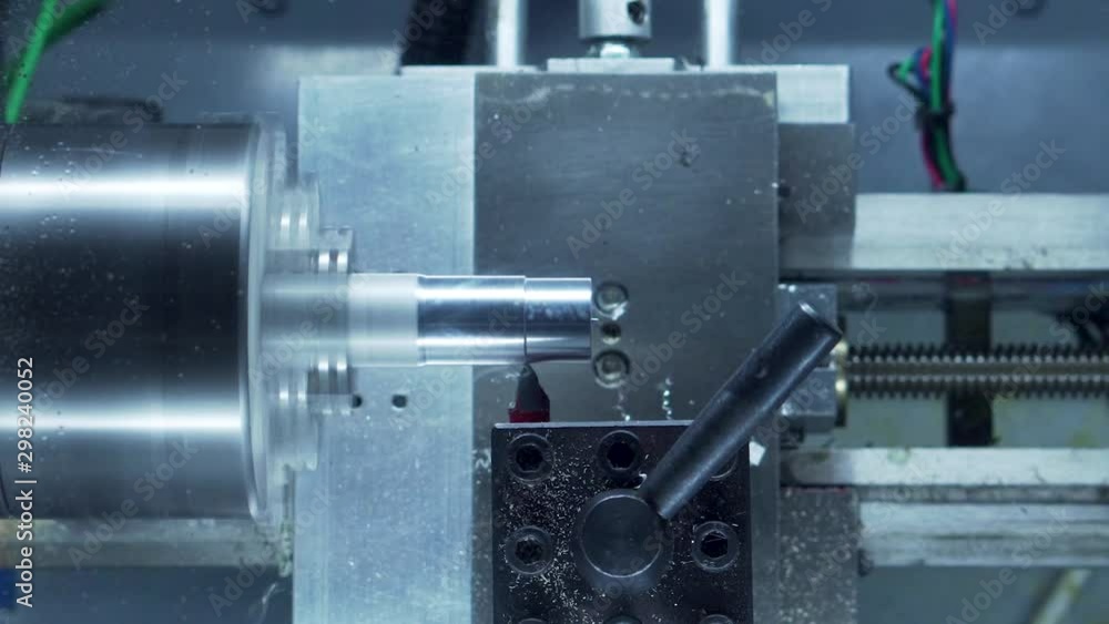 Desktop CNC lathe cutting chess pawn out of aluminum stock 30 second time lapse close up Desktop CNC lathe cutting chess pawn out of aluminum stock 30 second time lapse close up