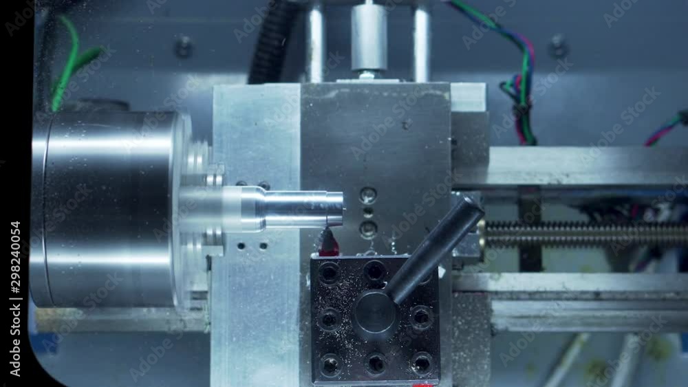 Desktop CNC lathe cutting chess pawn out of aluminum stock 15 second time lapse medium shot Desktop CNC lathe cutting chess pawn out of aluminum stock 15 second time lapse medium shot