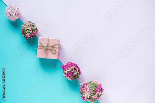 Gifts and decor on pastel blue and pink background. Holidays concept. Flat lay, top view, copy space. Valentine's Day background.