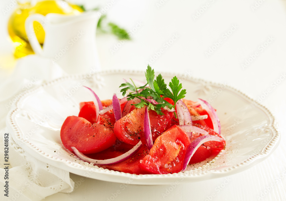 Tomato and onion salad. Selective focus Tomato and onion salad. Selective focus