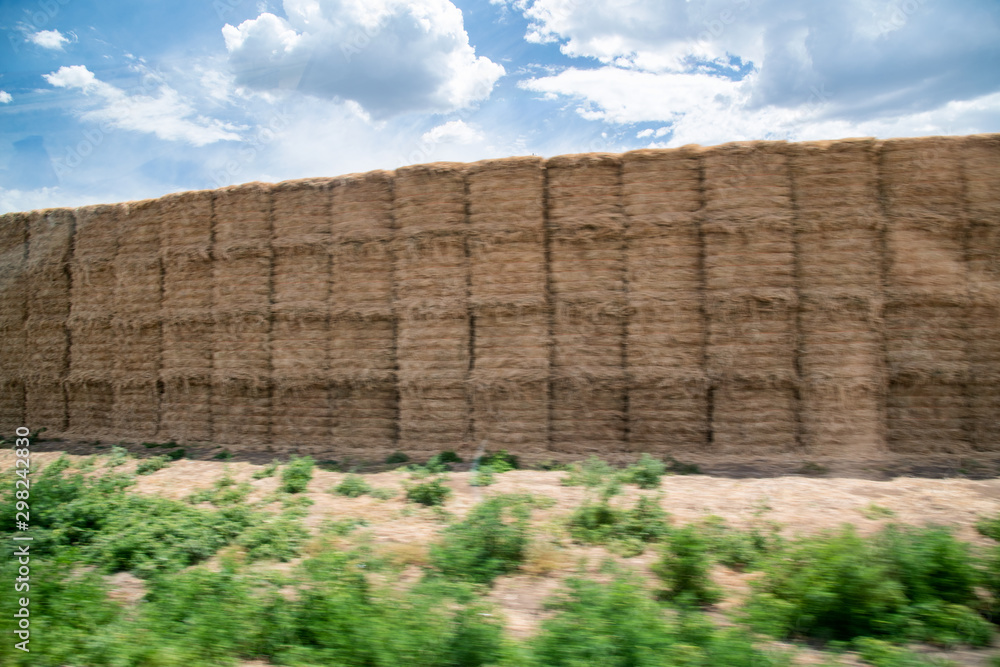 Fototapeta premium Blurred view of hay stacks