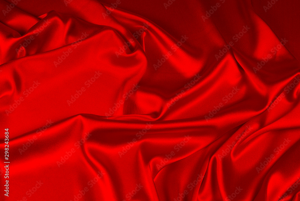 Red silk or satin luxury fabric texture can use as abstract background. Top view. Red silk or satin luxury fabric texture can use as abstract background. Top view.