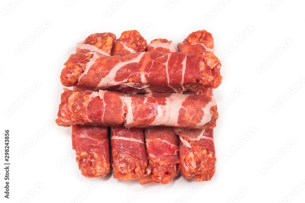 Chevapchichi in bacon isolated on white background. Chevapchichi in bacon isolated on white background.