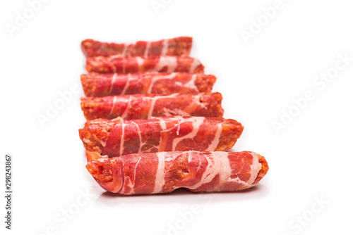 Chevapchichi in bacon isolated on white background. photo