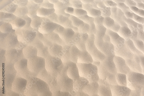 Bild auf Leinwand Hot fine dry desert sand with dimples as background top view close up