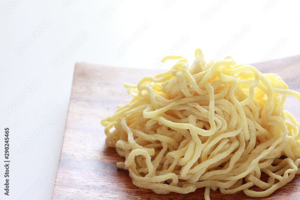 Chinese food ingredient, ramen noodles on wooden plate
