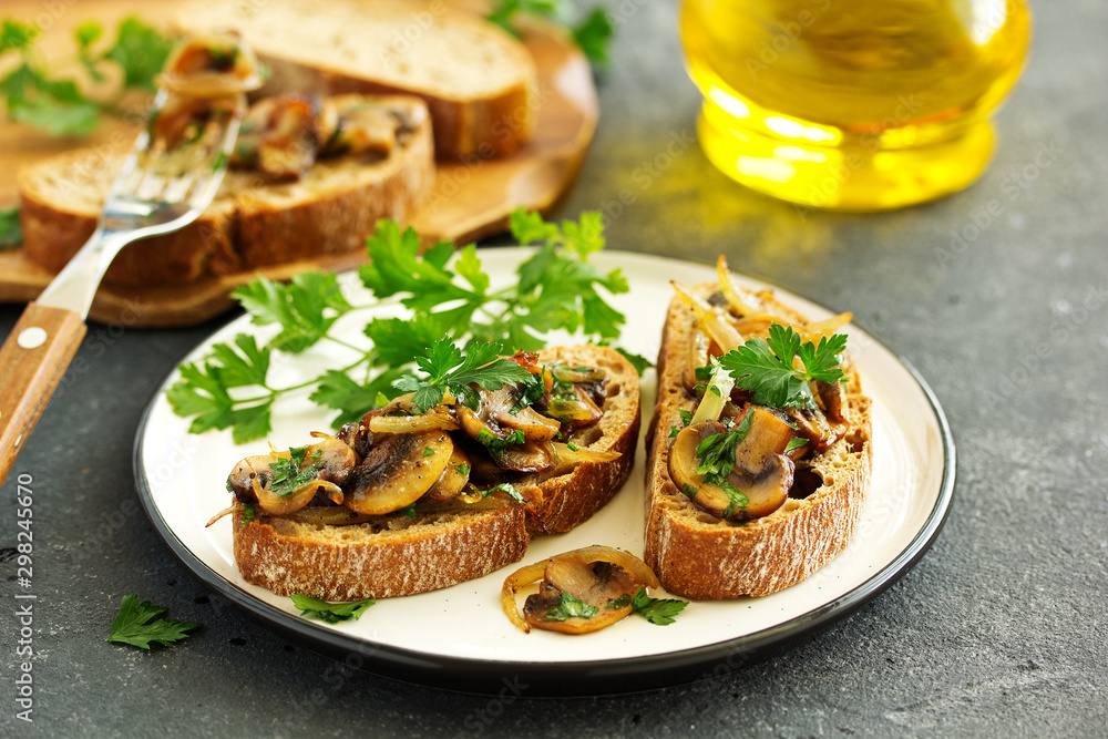 Bruschetta with fried mushrooms with onions and parsley. Bruschetta with fried mushrooms with onions and parsley.