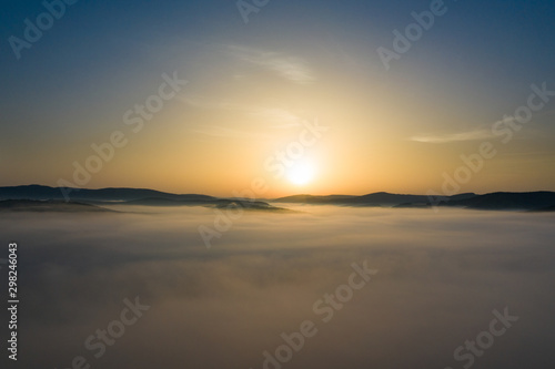 Wallpaper Mural Misty sunrise with sunrays over the hills in Transylvania, Romania. Torontodigital.ca