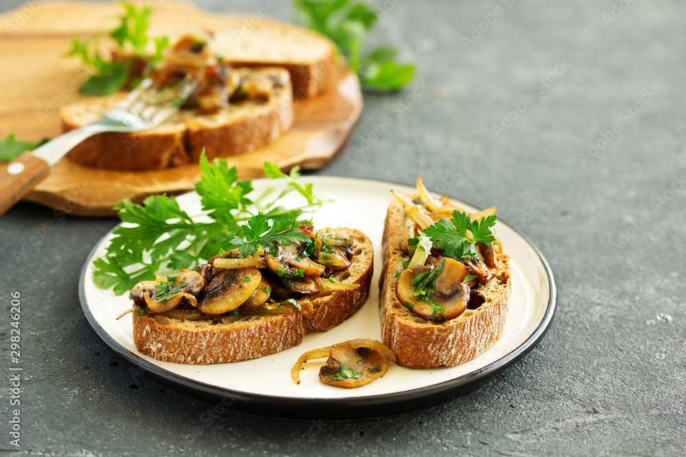 Bruschetta with fried mushrooms with onions and parsley. Bruschetta with fried mushrooms with onions and parsley.
