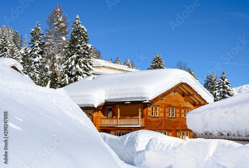 Wood chalet in  winter resort Davos - the home of annual  World Economy Forum. © borisbelenky