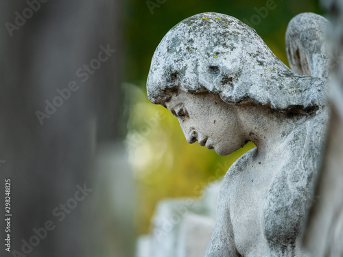Detail of an old gravestone in St. Marx Cemetery in autumn