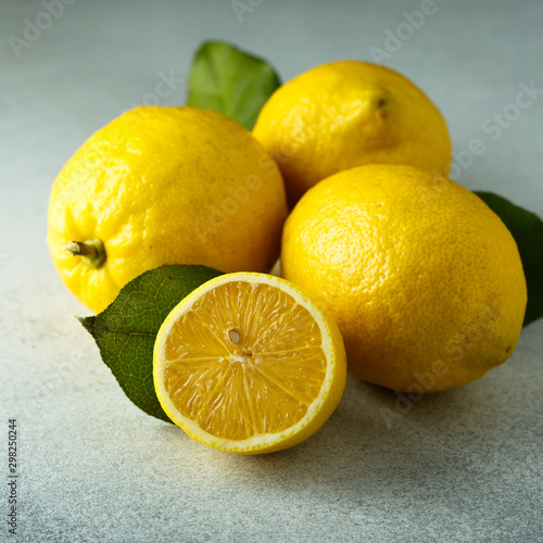 Fresh lemons with green leaves
