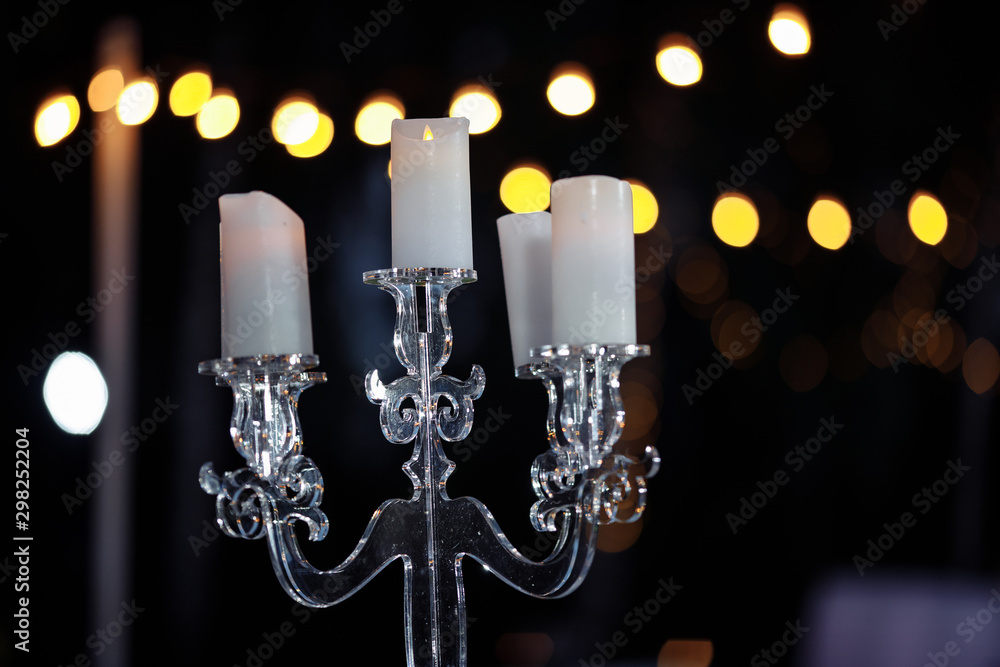 glass candlestick at night on the table glass candlestick at night on the table