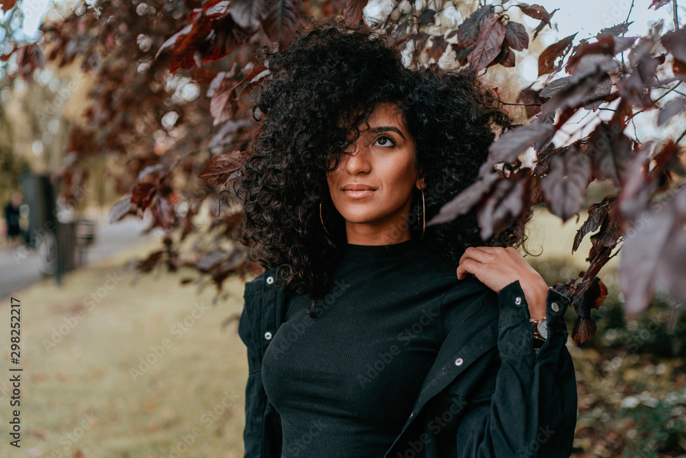 Portrait Charming Young African Woman with Curly Hair, Street Style Portrait Charming Young African Woman with Curly Hair, Street Style