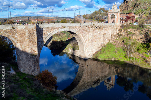 Scenic view of an ancient stone bridge over the Tagus River near Toledo.