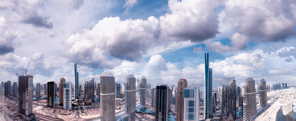 Fototapeta premium Dubai at sunset, UAE. Amazing aerial view from drone