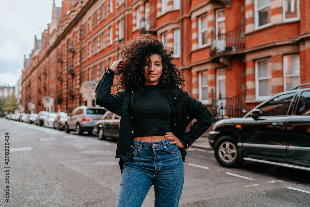 Portrait Charming Young African Woman with Curly Hair, Street Style Portrait Charming Young African Woman with Curly Hair, Street Style