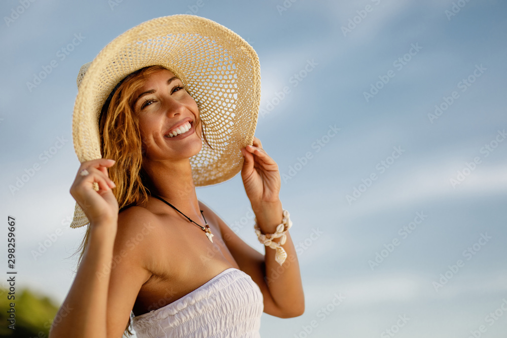 Portrait of beautiful happy woman in summer day.