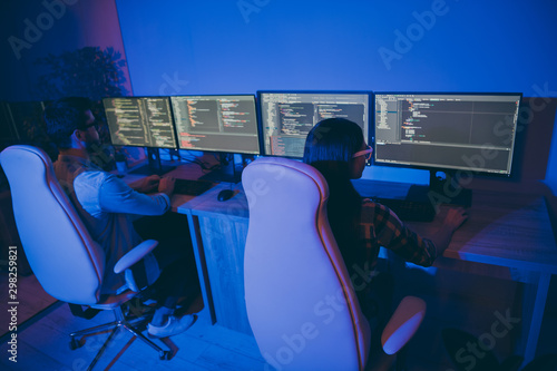 Obraz na plátně Rear behind view photo of it specialist guy lady business people night hard-work