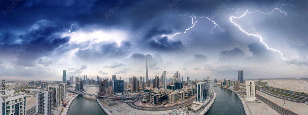 Obraz premium Dubai, United Arab Emirates. Amazing aerial view of downtown skyscrapers on a stormy evening