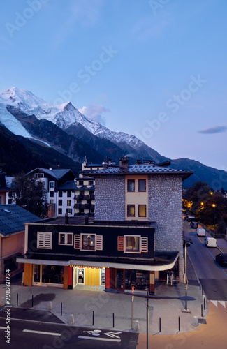 Stone building in Chamonix on the background of Mont Blanc. Alps, France. © badahos