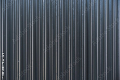 Dark grey colourbond sheet metal fencing background texture