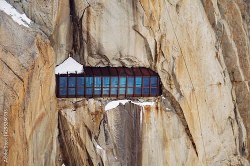  Iron construction with windows in Mount Aiguille du Midi for tourists and climbers. Chamonix-Mont-Blanc, France.