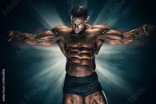 Handsome Muscular Bodybuilder Flexing Muscles photo