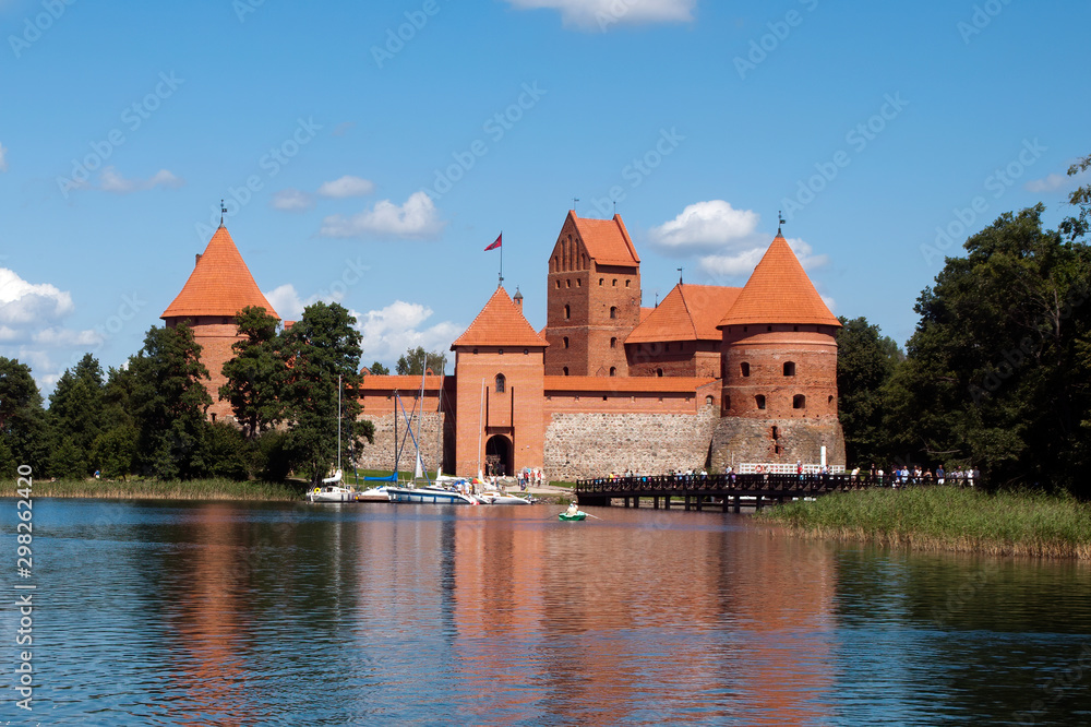 Fototapeta premium Trakai Lithuania, red brick castle by lake