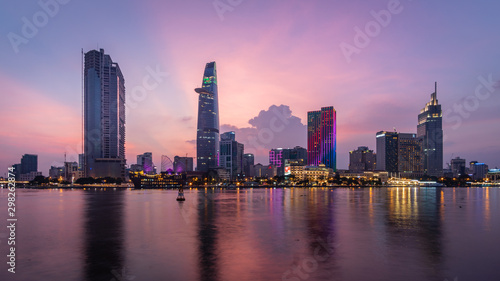Sunset of night Ho Chi Minh Skyline of Financial District. Saigon , Vietnam.city illuminated with colorful sky © Michele