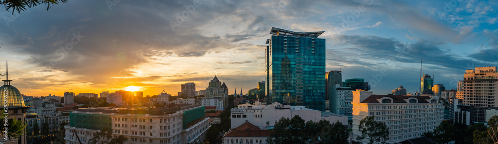 aerial view panoramic shot of District One at Sunset. Famous touristic quarter during golden hour. Ho Chi Minh, Vietnam.