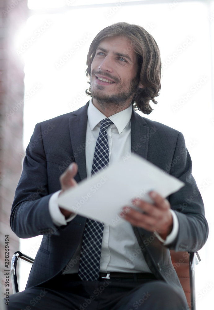 A relaxed conversation of a man and a woman in the office A relaxed conversation of a man and a woman in the office