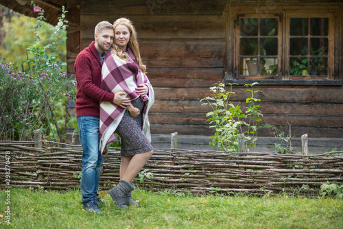 A portrait of young married couple expecting a baby