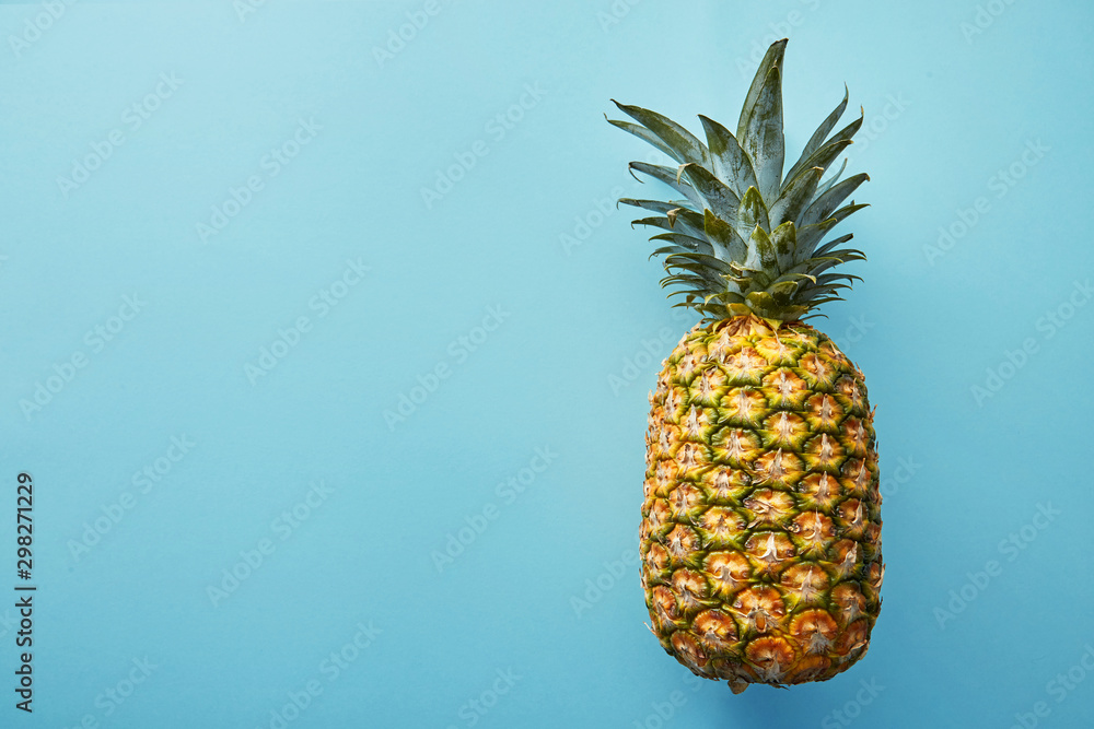 Tasty pineapple on  colored  background, flat lay. Pineapple on a colored background