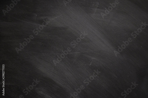Texture of chalk on blackboard or chalkboard background, can be use as concept for school education, dark wall backdrop , design template. photo
