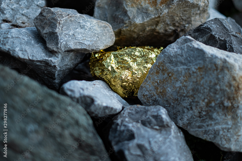 Gold nugget and grey granite stone