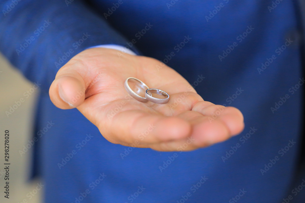 Wedding rings in a man's hand Wedding rings in a man's hand